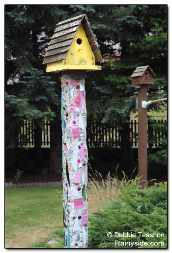 birdhouse on a mosaic pole